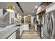 Modern kitchen with stainless steel appliances, white cabinets, and stylish countertops, perfect for culinary enthusiasts at 2161 Elmwood St, Berthoud, CO 80513