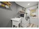 Convenient laundry room with modern washer, dryer, sink, and great natural light from a backyard view at 2161 Elmwood St, Berthoud, CO 80513