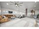 Open living area with a fireplace, comfortable seating, and modern staircase, ideal for Gathering gatherings at 2161 Elmwood St, Berthoud, CO 80513