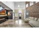 Bright living room with hardwood floors, a modern fireplace, and ample natural light at 2161 Elmwood St, Berthoud, CO 80513