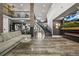 Spacious living room featuring modern lighting, hardwood floors, fireplace, and an open floor plan at 2161 Elmwood St, Berthoud, CO 80513