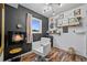 Cozy room with a fireplace, salon chair, and stylish decor, creating a relaxing and inviting atmosphere at 2161 Elmwood St, Berthoud, CO 80513