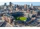 Aerial view of a baseball stadium amidst a sprawling city skyline at 1475 Delgany St # 306, Denver, CO 80202