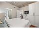 Cozy bedroom with ample closet space, modern furniture, and a calming color scheme at 1475 Delgany St # 306, Denver, CO 80202