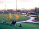 Scenic park view with trees and downtown Denver skyline in the distance at sunset at 1475 Delgany St # 306, Denver, CO 80202