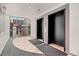 Modern elevator lobby featuring two elevators and a window with city views at 1475 Delgany St # 306, Denver, CO 80202