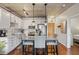 Charming kitchen and dining area featuring stainless steel appliances, modern lighting, and light countertops at 1475 Delgany St # 306, Denver, CO 80202