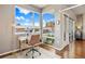 Bright office space with hardwood floors and a large window leading to a private balcony at 1475 Delgany St # 306, Denver, CO 80202