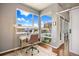 Bright and open office with hardwood floors and access to a balcony through sliding doors at 1475 Delgany St # 306, Denver, CO 80202