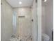 A modern bathroom with custom tile and glass shower at 5265 W Quarles Dr, Littleton, CO 80128