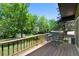 Outdoor deck area with green views and wrought iron chairs and table at 5265 W Quarles Dr, Littleton, CO 80128