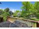 Outdoor deck overlooking lush backyard, perfect for outdoor dining and entertaining at 5265 W Quarles Dr, Littleton, CO 80128