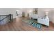 Spacious open-concept living room with sleek hardwood floors and a comfortable seating area at 5265 W Quarles Dr, Littleton, CO 80128