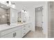 Modern bathroom features double sinks, walk-in closet and glass-enclosed shower at 8242 S Pierson St, Littleton, CO 80127