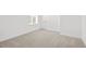 Cozy bedroom with neutral carpet, base trim, and one window offering natural light at 8242 S Pierson St, Littleton, CO 80127