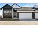 Charming modern two-story home with a two-car garage and sleek architectural details at 8242 S Pierson St, Littleton, CO 80127