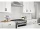 Elegant kitchen featuring quartz countertops, stainless steel appliances, and gas range at 8242 S Pierson St, Littleton, CO 80127