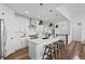 Bright kitchen with a large central island and stainless steel appliances at 8242 S Pierson St, Littleton, CO 80127
