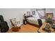 Charming bedroom with a rocking chair, bed with storage, and desk area, creating a cozy and functional space at 13802 Jasmine St, Thornton, CO 80602