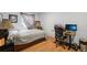 Cozy bedroom with wood floors, a comfortable bed, and a functional desk area, perfect for work or study at 13802 Jasmine St, Thornton, CO 80602