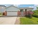 Charming home featuring a well-maintained lawn, brick accents, and a convenient two-car garage at 13802 Jasmine St, Thornton, CO 80602