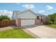A beautiful exterior view of a well-kept home with a spacious driveway and inviting curb appeal at 13802 Jasmine St, Thornton, CO 80602