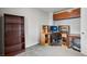 Functional home office with shelving, desk, and neutral walls, ideal for a productive workspace at 13802 Jasmine St, Thornton, CO 80602