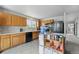 Bright kitchen featuring wood cabinets, modern appliances, and ample counter space for meal preparation at 13802 Jasmine St, Thornton, CO 80602