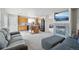 Inviting living room showcasing a fireplace, tv, and a seamless view into the adjacent kitchen area at 13802 Jasmine St, Thornton, CO 80602