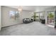 Bright, airy living room with ample natural light, neutral decor, and an open floor plan at 13802 Jasmine St, Thornton, CO 80602