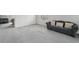 Open living room featuring natural light, neutral walls, and a comfortable sofa, perfect for relaxing and entertaining at 13802 Jasmine St, Thornton, CO 80602