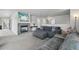 Cozy living room with a fireplace, neutral walls, and plush gray carpeting for comfort at 13802 Jasmine St, Thornton, CO 80602