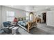 Spacious main bedroom with wooden bed frame, natural light, and access to a Primary bathroom at 13802 Jasmine St, Thornton, CO 80602