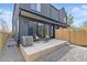 This backyard has a patio, privacy fence, and access to the house through glass doors at 2961 S Cherokee, Englewood, CO 80110