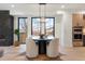 Dining area showcasing a round table, modern light fixture, and large windows for natural light at 2961 S Cherokee, Englewood, CO 80110