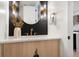 Elegant powder room with stylish mirror, fixtures, and a bright vanity at 2961 S Cherokee, Englewood, CO 80110