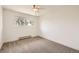 Simple bedroom with neutral carpet and a window at 12196 W Belleview Dr, Littleton, CO 80127