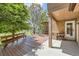Relax on the covered deck with built in grill, wood storage and bench at 12196 W Belleview Dr, Littleton, CO 80127