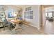 Home office with built-in shelving and a large window at 27481 E Cedar Ave, Aurora, CO 80018