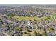 An aerial view showing a neighborhood adjacent to a golf course at 2247 Eagles Nest Dr, Lafayette, CO 80026