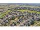 Aerial view of community with mature trees and golf course at 2247 Eagles Nest Dr, Lafayette, CO 80026