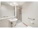 Bathroom featuring a tile shower and pedestal sink at 2247 Eagles Nest Dr, Lafayette, CO 80026