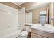 Cozy bathroom with a shower-tub combo, ample counter space, and a neutral color palette at 2247 Eagles Nest Dr, Lafayette, CO 80026