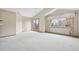 Bright bedroom features vaulted ceilings, neutral walls, plush carpet, and access to private outdoor balcony at 2247 Eagles Nest Dr, Lafayette, CO 80026