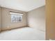 Neutral bedroom with a large window offering lots of natural light and neutral carpet flooring at 2247 Eagles Nest Dr, Lafayette, CO 80026