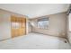 Bright and airy bedroom with carpet flooring, a double closet, and a large window at 2247 Eagles Nest Dr, Lafayette, CO 80026