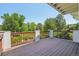 Beautiful wooden deck overlooking a lush yard, perfect for outdoor dining or relaxing in nature at 2247 Eagles Nest Dr, Lafayette, CO 80026