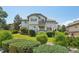 A beautiful home featuring green landscaping, and a multi-level deck perfect for enjoying outdoor living at 2247 Eagles Nest Dr, Lafayette, CO 80026