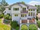 Charming home exterior with decks and manicured landscaping, creating an inviting outdoor living space at 2247 Eagles Nest Dr, Lafayette, CO 80026