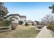 Exterior view showcasing landscaping, lawn, and walkway at 2247 Eagles Nest Dr, Lafayette, CO 80026